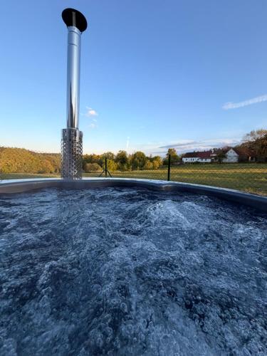 a pool of water in front of a power plant at Chalupa Radouň in Jindřichŭv Hradec