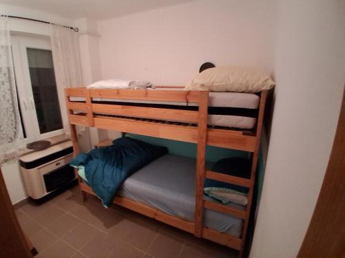 a couple of bunk beds in a room at Ferienhaus Schlothauer 1 in Tiszacsege
