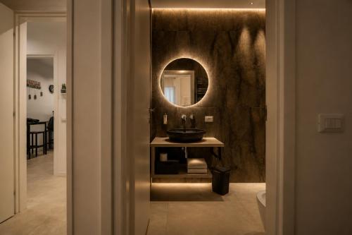 a bathroom with a sink and a mirror at Sicily Luxury Rooms in Palermo