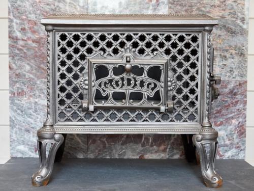 an ornate metal chair in front of a wall at The Challoners in Robertsbridge
