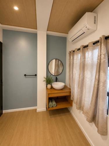 a bathroom with a sink and a mirror at GASA Guesthouse in Compostela