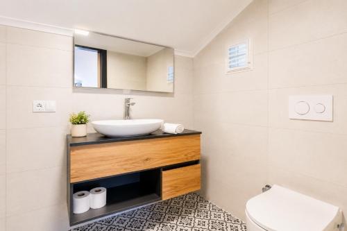 a bathroom with a sink and a toilet at Villa Aysel Paradise in Dalyan