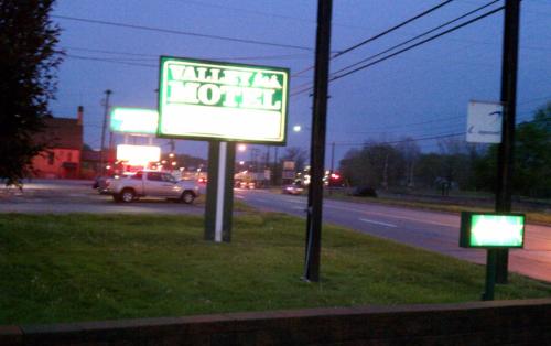 a sign for a motel on the side of a road at Valley Motel Pittsburgh in Harmarville