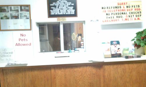 a counter in a restaurant with signs on the wall at Valley Motel Pittsburgh in Harmarville