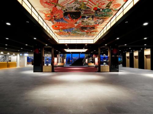 a large room with a painting on the ceiling at Mercure Saga Karatsu Resort in Karatsu