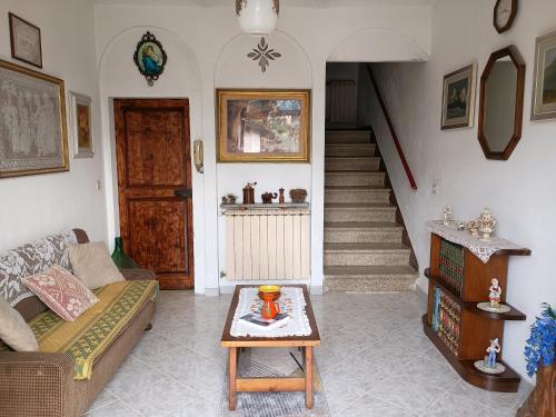 a living room with a couch and a table at Casa Branchetti in Quarrata