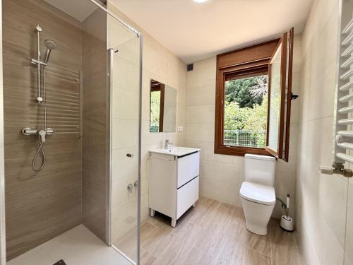 a bathroom with a toilet and a sink and a shower at La Villa de Miera - 12809 in Ajo