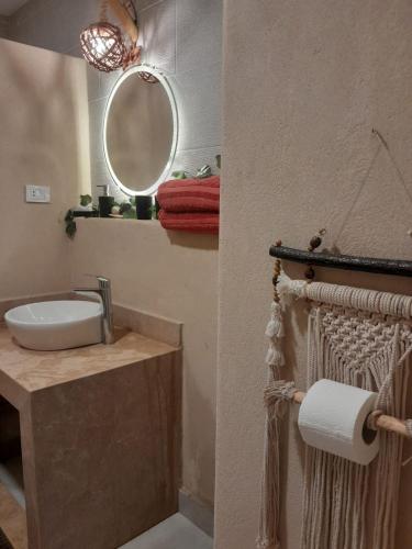 a bathroom with a sink and a mirror at Sina Cave in Dahab