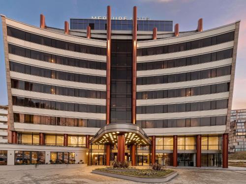 an office building with a large building at Mercure Sofia City in Sofia