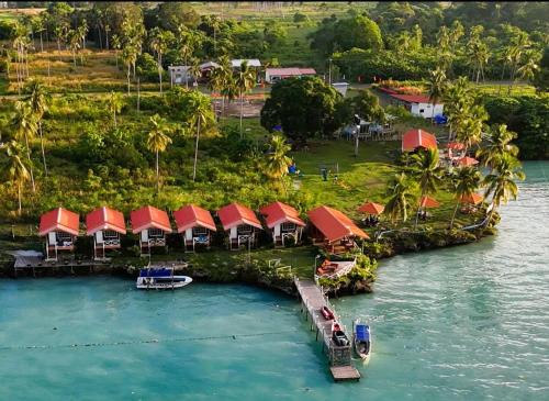 an aerial view of a resort on an island in the water at Panglima Resort Bum Bum Island, Semporna in Semporna
