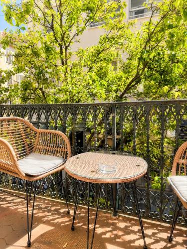 a patio with two chairs and a table at Totolulu Cannes Luxury Properties in Cannes