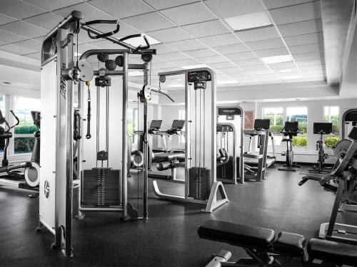 a gym with several rows of treadms and machines at Ocean Pointe Resort Two-Bedroom Villa in Palm Beach Shores