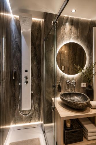a bathroom with a sink and a shower at Sicily Luxury Suites in Palermo