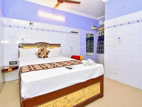 a bedroom with a bed in a room at SNN Residency in Rāmeswaram