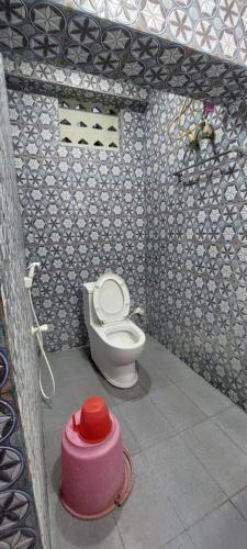 a bathroom with a toilet in a room at SNN Residency in Rāmeswaram