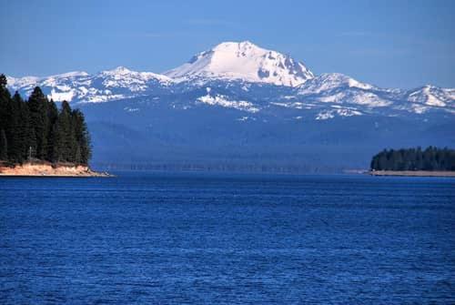a mountain in the distance with a large body of water at Luxury Cabin on Golf Course / Private Spa & Launch in Prattville