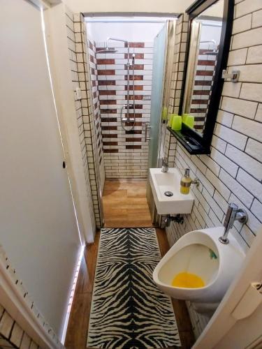 a small bathroom with a sink and a toilet at Hvar old Town Boutique in Hvar