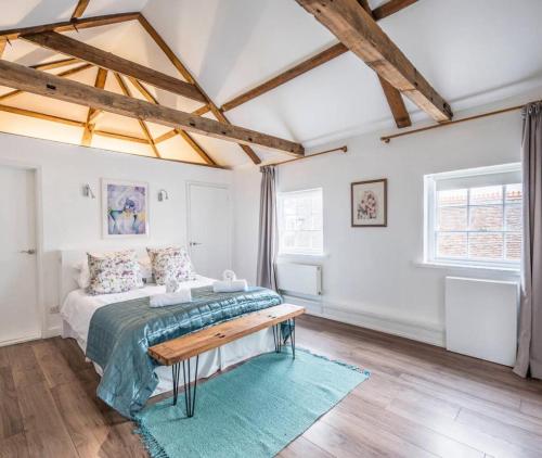a bedroom with a bed and a table at Loft in Bungay in Bungay