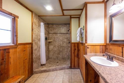 a bathroom with a shower and a sink at Union Creek Resort in Union Creek