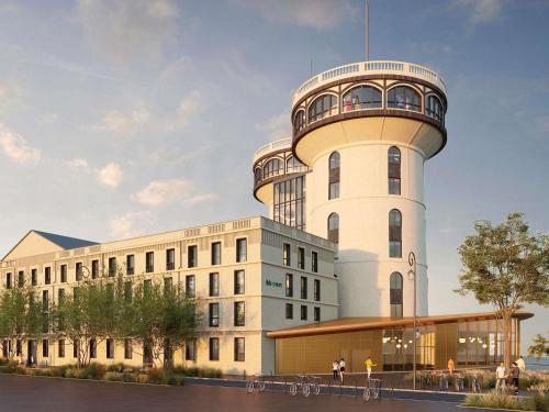 a building with a control tower on top of it at Ibis Styles Saint Germain en Laye in Saint-Germain-en-Laye