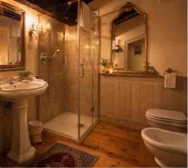 a bathroom with a shower and a sink and a toilet at Villa Dorigny Dimora Storica con Affreschi e Giardino in Verona