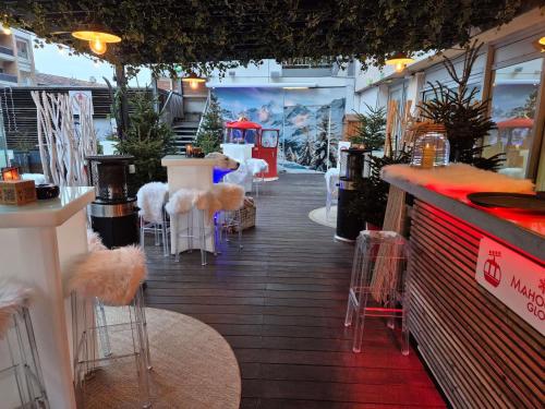 a store aisle with tables and stools in a store at Mercure Toulouse Centre Saint-Georges in Toulouse