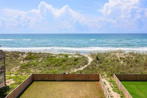 a view of the ocean from a house at 8910 - Aquasition in Hatteras
