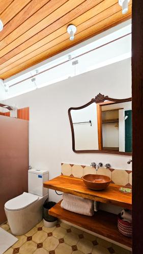 a bathroom with a sink and a toilet at Pousada Casa de Salim in Lençóis