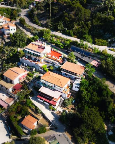 an overhead view of a town with a train passing by at Hotel Alma in Campo nell'Elba