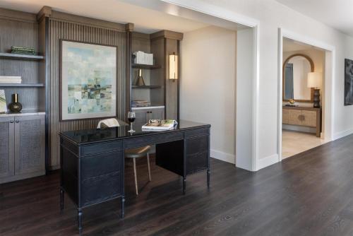 an office with a black desk in a room at Hilton Orlando in Orlando