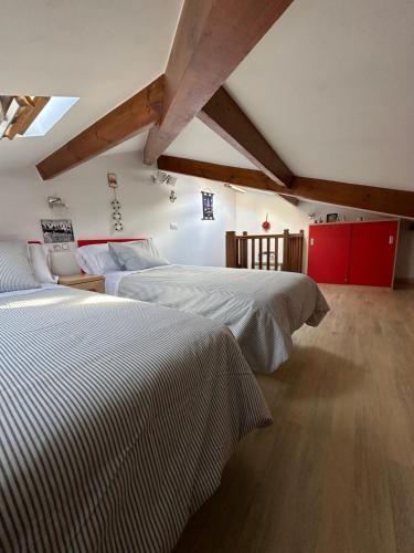 a bedroom with two beds in a room at La casina de Marga in Villaviciosa