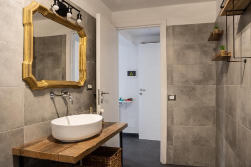 a bathroom with a sink and a mirror at Annarè in Focene