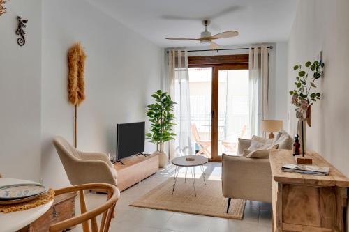 a living room with a couch and a table at Bon Dia Moraira in Moraira