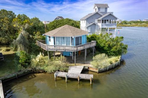an aerial view of a house on an island in the water at 8951 - Ozzie's Island Hideaway in Hatteras