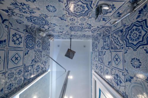 a room with blue and white tiles on the ceiling at Grecale - stunning sea-view apartment with patio, up to 5 guests in Maiori