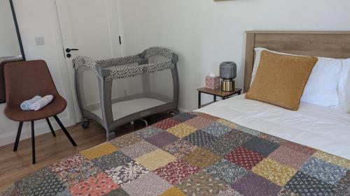 a bedroom with a bed and a chair at Trim private rooms in Trim