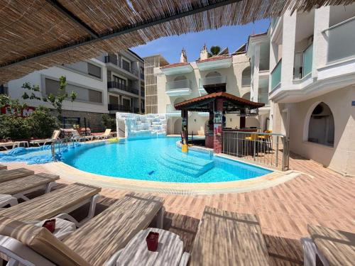 a swimming pool with a water slide in a building at Rayon Apart hotel in Marmaris