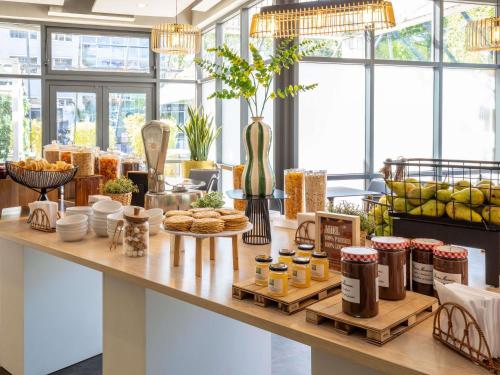 a counter with various food items on it at ibis Styles Paris Bercy in Paris