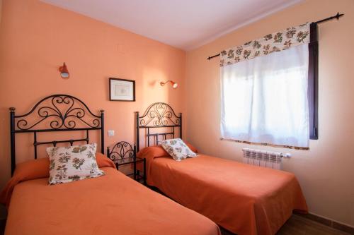 Postel nebo postele na pokoji v ubytování El Leñador I