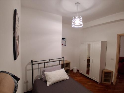 a bedroom with a bed with a pillow on it at Suite Isernia Centro in Isernia