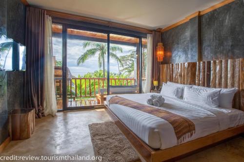 Postel nebo postele na pokoji v ubytování Andalay Beach Resort Koh Libong