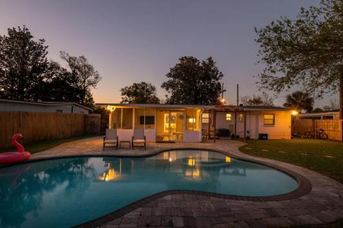 a swimming pool in the backyard of a house at Teal We Meet Again - Team Joseph Ellen in Jacksonville Beach