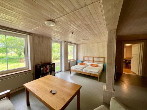 a living room with a couch and a table at Ferienwohnung Runeholm in Fjälster