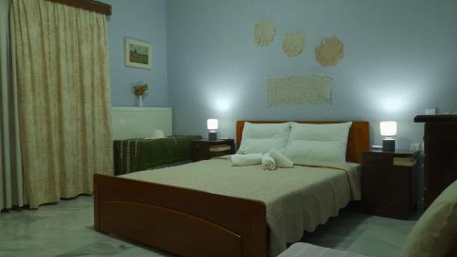 a bedroom with a bed with a stuffed animal on it at The Village Corner in Politika