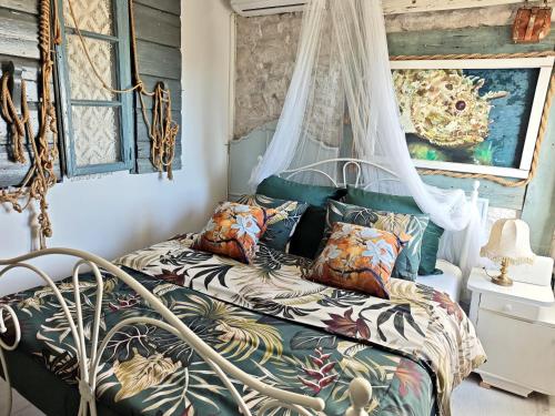 a bedroom with a bed with a canopy at Villa Lido 145 m2 with pool in Krnica