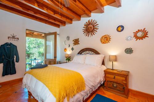 a bedroom with a large bed and a window at La Sagrada in Guanajuato
