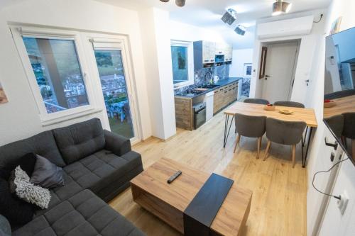 a living room with a couch and a table at Guest House Lejla in Travnik