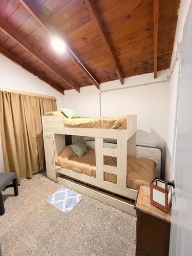 a bedroom with a bunk bed in a room at Villa Valeria in General Acha