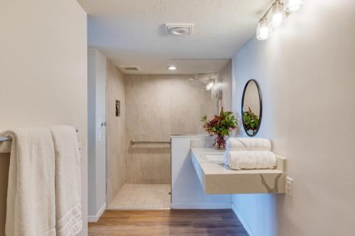 a bathroom with a sink and a mirror at The Mara Laguna Beach, an AvantStay Hotel in Laguna Beach