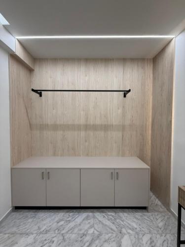 a room with a white shelf on a wall at Meraki Luxury Retreat in Kos